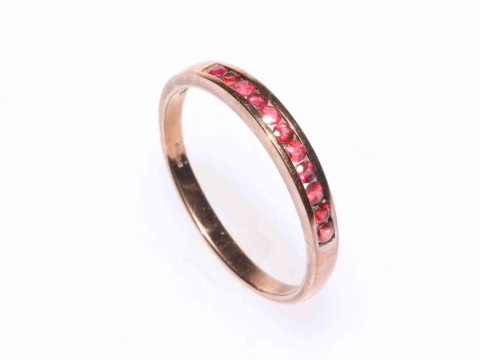 Eleven ruby channel set ring, 9 carat gold, size Z.