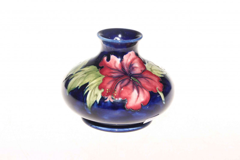 Moorcroft Pottery hibiscus vase, bearing warrant label, 10.5cm.