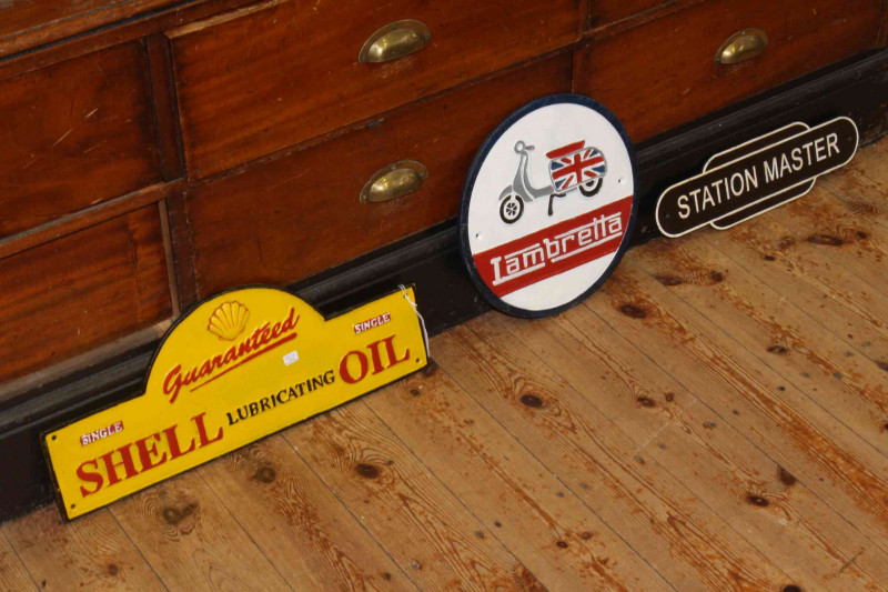 Shell Oil, Lambretta and Station Master cast metal signs.