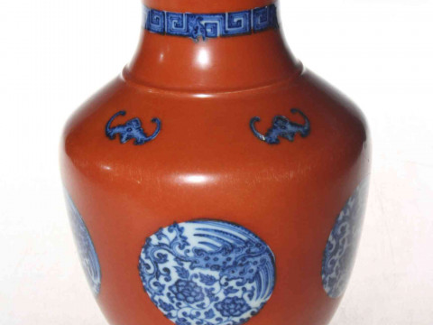 Chinese porcelain vase, having blue and panels on red ground, underglaze...