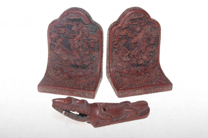 Chinese cinnabar bookends and terracotta animal.