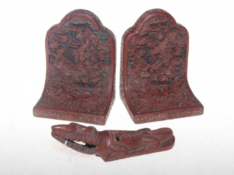 Chinese cinnabar bookends and terracotta animal.