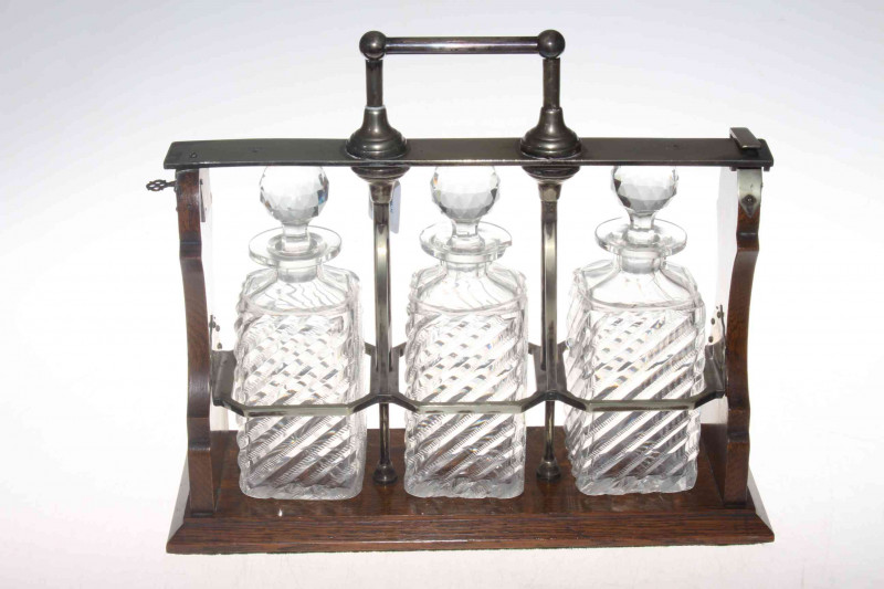 EP mounted oak three decanter tantalus.