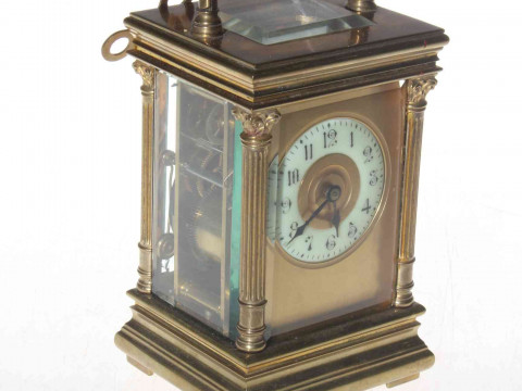 Gilt brass striking carriage clock, the case having corinthian columns...