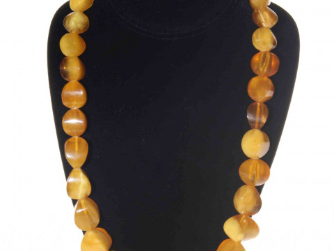 Amber bead necklace of graduated irregular form, 60cm.