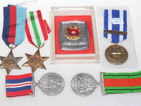 Four WWII medals, and two others.
