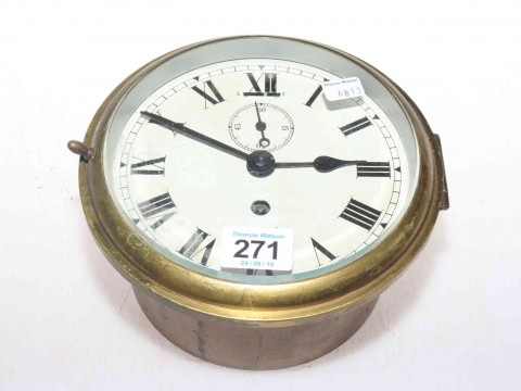 Smith's brass cased ships clock with Roman numerals.