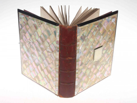 Mother of pearl bound photograph album.