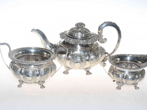 George IV silver three piece tea service, each circular lobed body with...