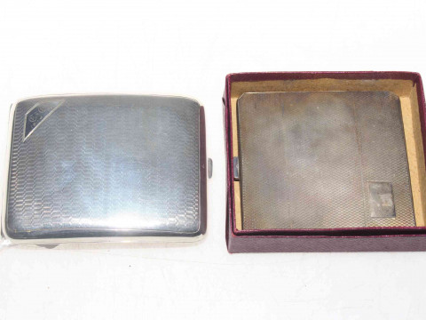 Two silver cigarette cases.