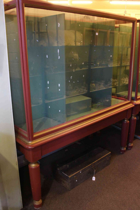 Painted showcase cabinet raised on turned legs with opposing doors, 194cm by 178cm by 84cm.