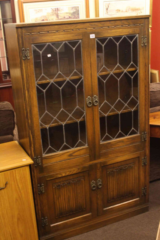 Old Charm oak four door cabinet bookcase.