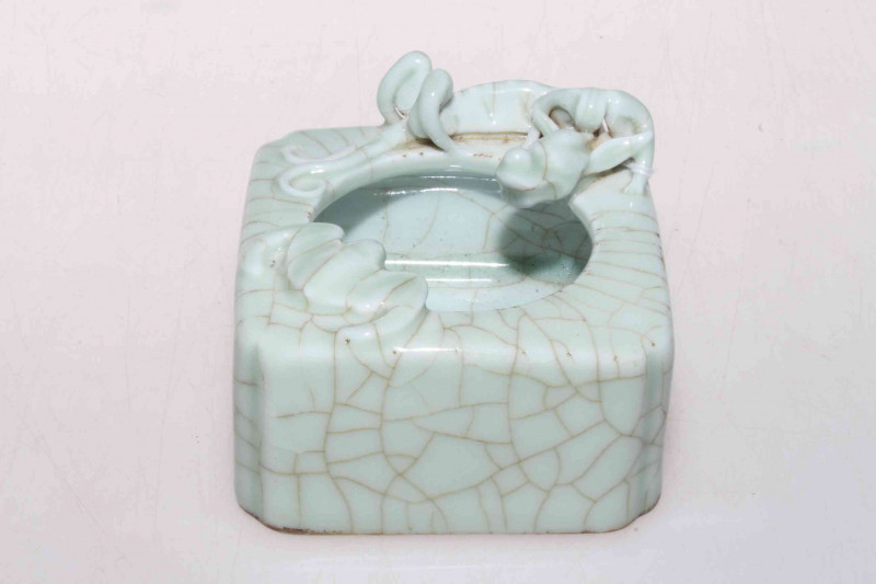 Chinese crackle glazed water pot with relief dragon and bat.