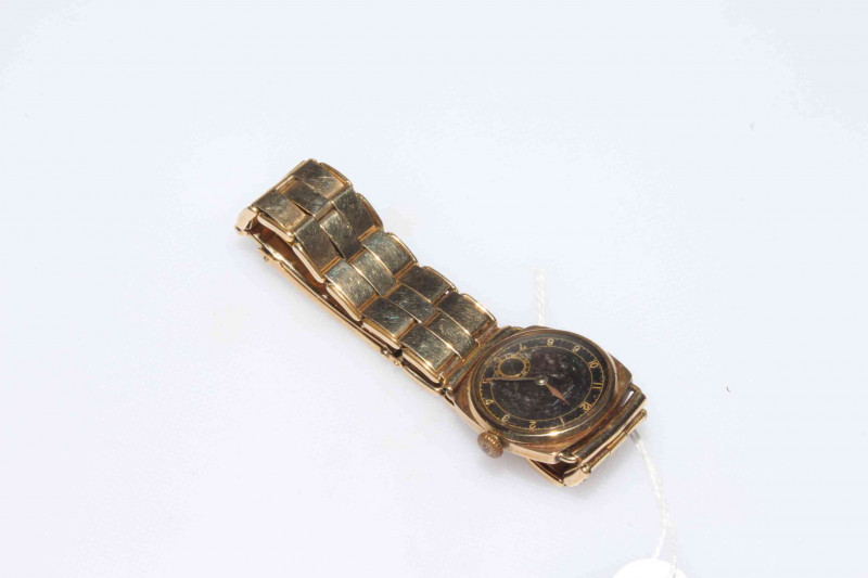 Gents 9 carat gold wristwatch with '9 carat metal core' bracelet.