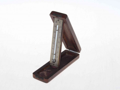 Wooden cased folding travelling thermometer.