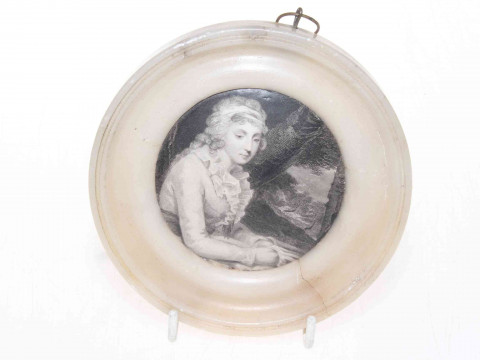 Pot lid in alabaster frame.