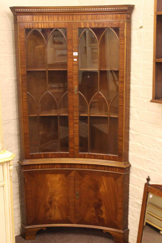 Bevan & Funnell Reprodux mahogany inverted bow front four door corner cabinet.