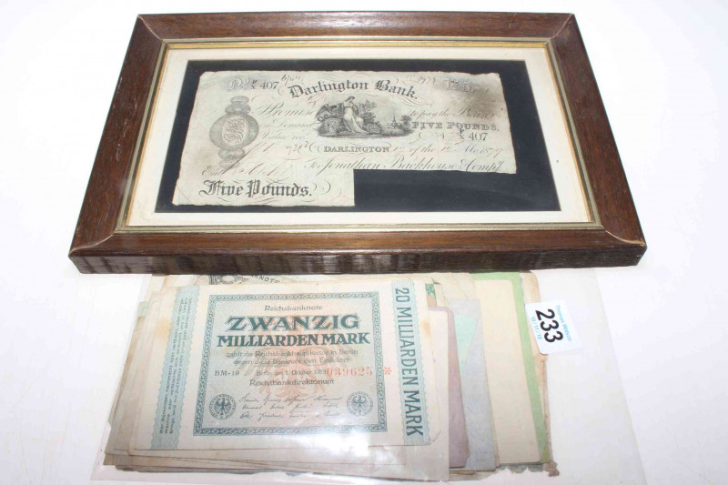 Loose German banknotes, some of high denominations together with a framed Stockton five pound 1895 white banknote and a framed Darlington five pound 1879 white banknote.