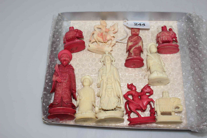 Ten Chinese carved ivory chess pieces.