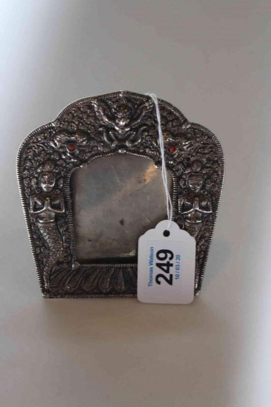 Persian figure decorated metal photograph frame.