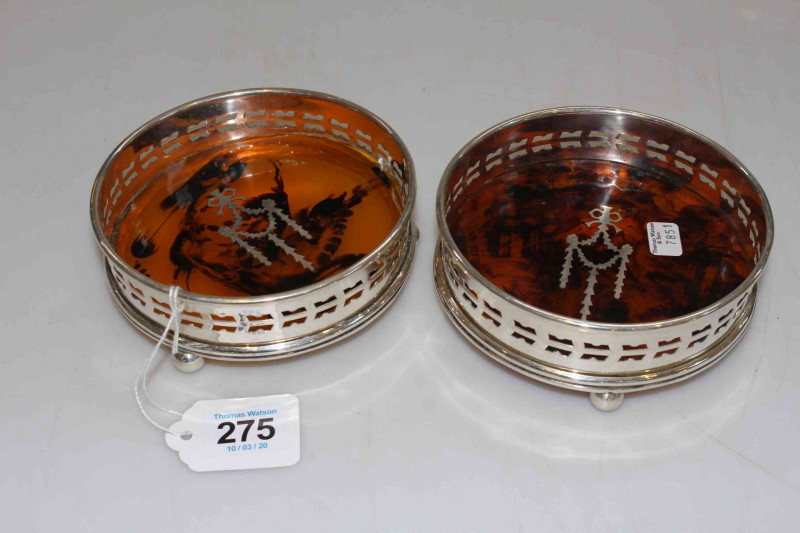 Pair silver plated wine bottle coasters.