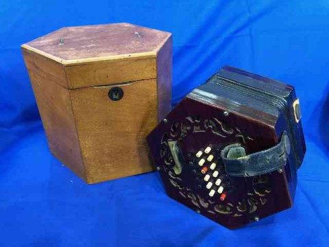 Concertina with 48 buttons and rosewood fretwork ends, in mahogany hexagonal...