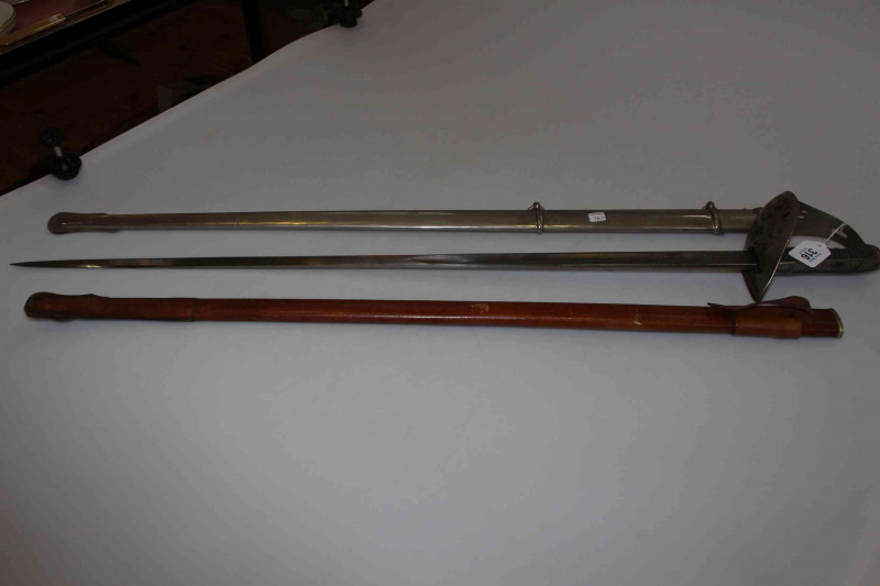 Victorian ceremonial sword and scabbard, the blade with engraved decoration together with a separate leather scabbard (2).