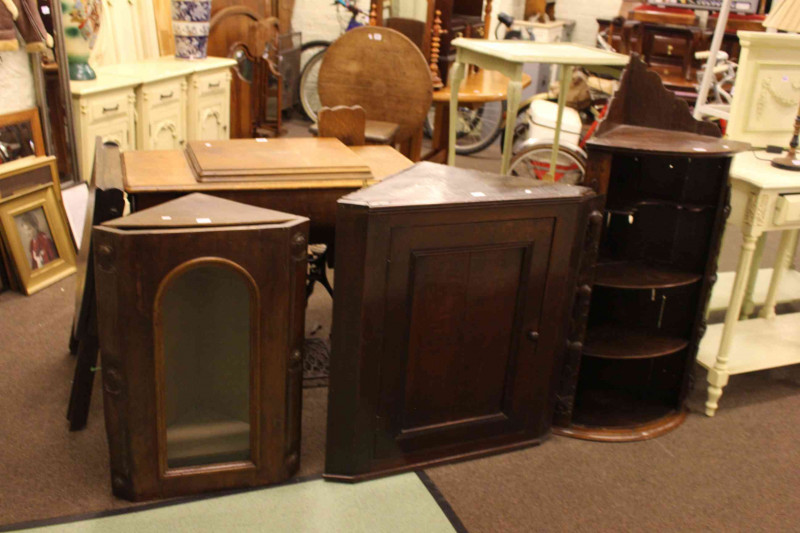 Three Victorian corner wall cabinets.