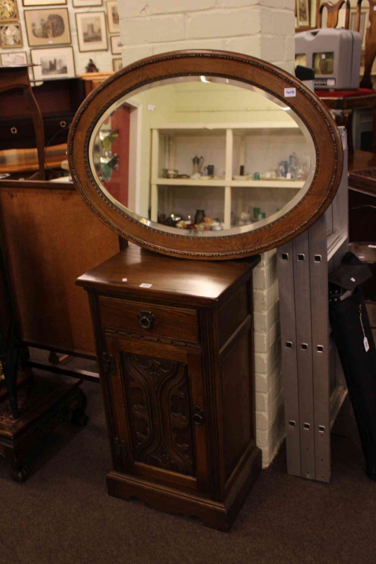 Old Charm oak pedestal cabinet and oval oak framed mirror.
