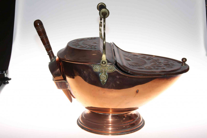 Victorian copper coal helmet with integrated shovel, embossed decoration to the top and brass handle.