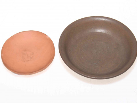 Two small Chinese pottery and terracotta shallow dishes.