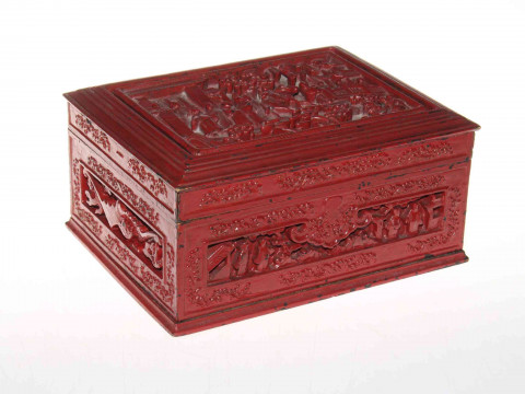 Chinese red lacquered carved wood box, with panels depicting figure in...