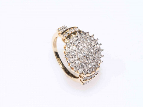 Diamond cluster ring set in 14Kt gold, comprising seventy diamonds, size...