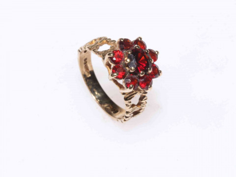 Garnet cluster ring set in 9 carat gold, size M.