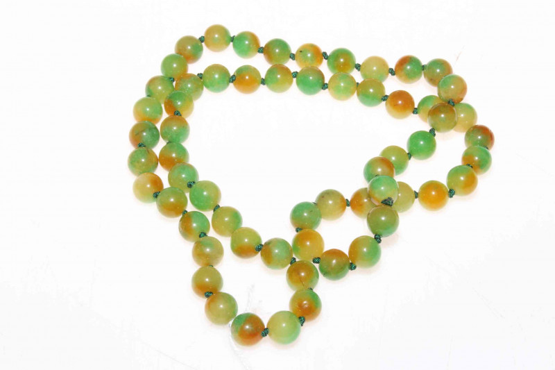 Chinese hardstone green and amber tinted beads.