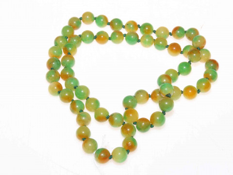 Chinese hardstone green and amber tinted beads.