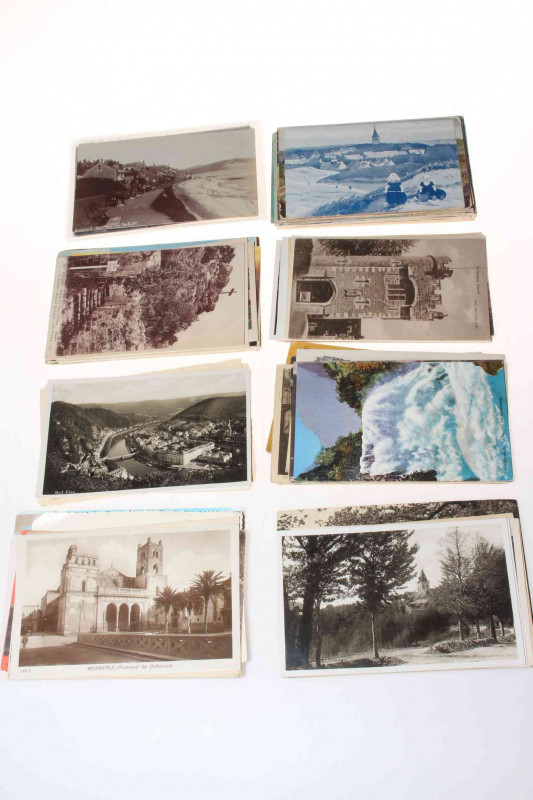 Wooden box of vintage to modern postcards including Lyme Regis RP, Taormina panoramic, France RP street scenes, vignette 1901 Hoboken, undivided backs, Milford Beach Auckland RP, Red Hill Canada RP, Tuck and Sons.