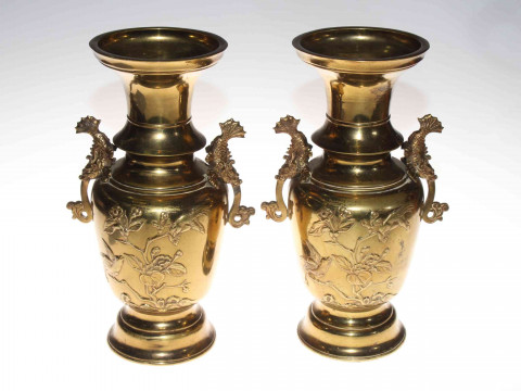 Pair Japanese brass two handled vases with relief bird and blossom decoration,...