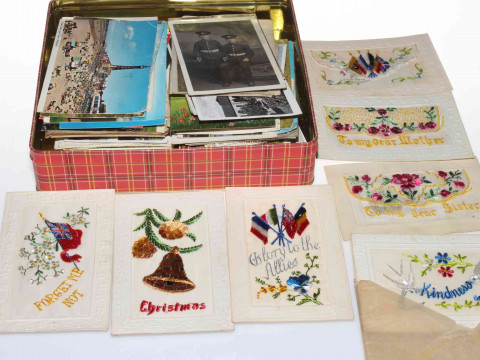 Tin of postcards including embroidered silks, military RP soldiers, topographical...