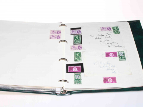 Great Britain circa 1840's-1960's stamp album depicting Penny Reds, Two...