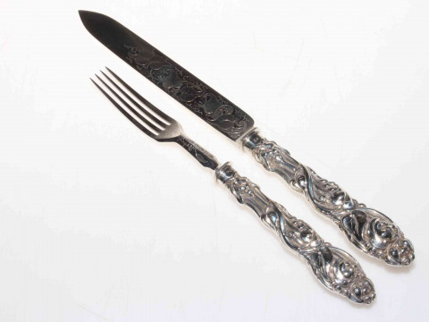 Ornate Victorian silver serving knife and fork.