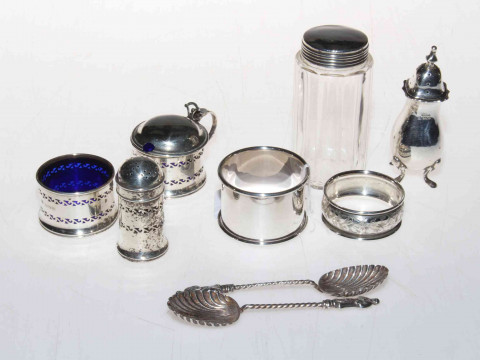 Silver cruets, two napkin rings, toilet bottle and two shell teaspoons...