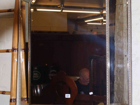 Octagonal silvered marginal wall mirror, 120cm by 80cm overall.