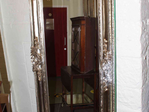 Rectangular ornate framed bevelled wall mirror, 203cm by 102cm overall.