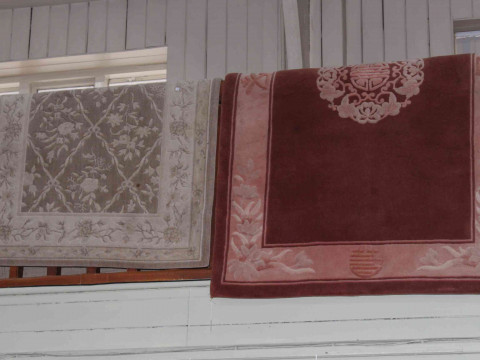 Rose ground Chinese rug 1.85 by 1.23 and pale green ground rug 1.73 by...