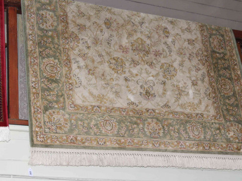 Green and beige ground Ziegler style carpet, 2.30 by 1.53.
