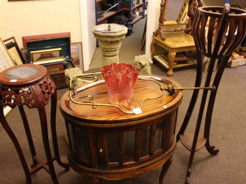Oval hardwood tray top cocktail cabinet and two plant stands (3).