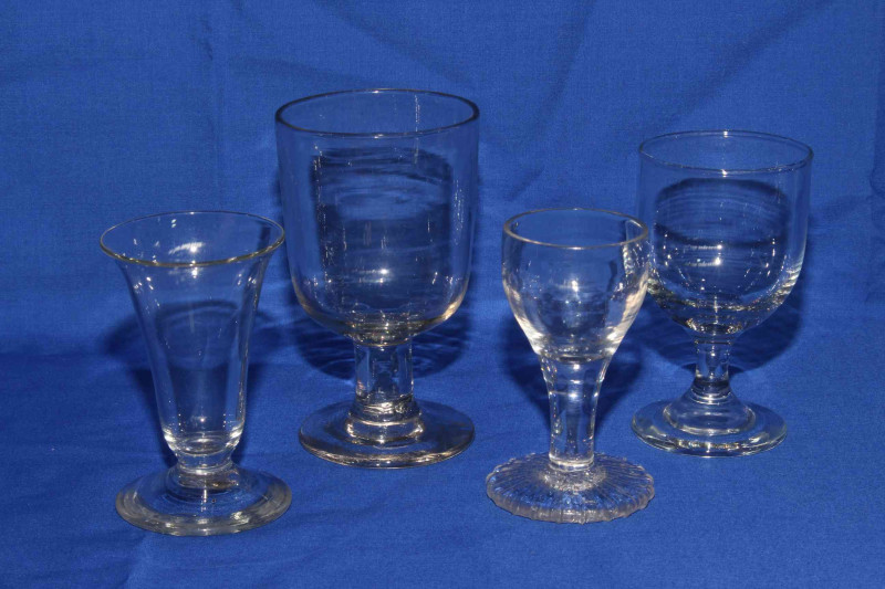 Collection of eight antique glasses including two cotton and air twist stems.