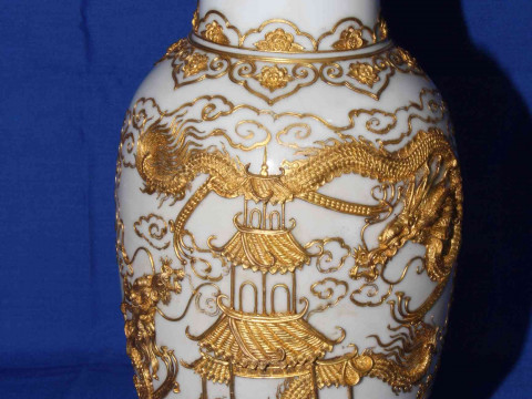 Pair Chinese vases having applied gilt decoration of pagoda and dragons on white ground, 30cm. thumbnail