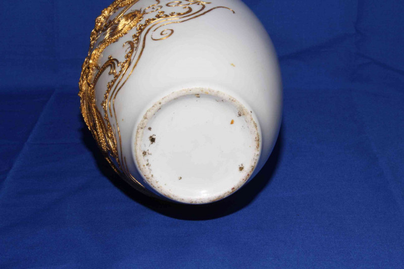 Pair Chinese vases having applied gilt decoration of pagoda and dragons on white ground, 30cm.